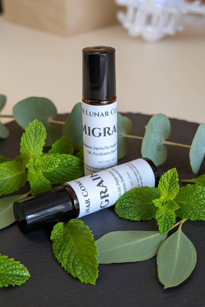 Two roll-on bottles labeled 'MIGRA' and 'GRAIN' on a surface with a blurred background.